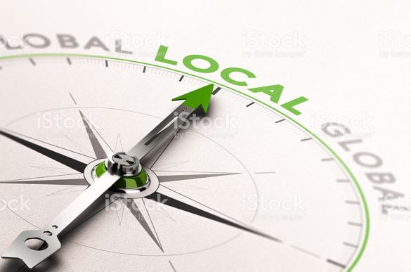 3D illustration of a compass with needle pointing the word local business. Concept of an ethical economy